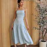 Light blue, floral sundress with spaghetti straps and a tiered skirt, ideal for summer or spring wear, purchase at SISTER NY