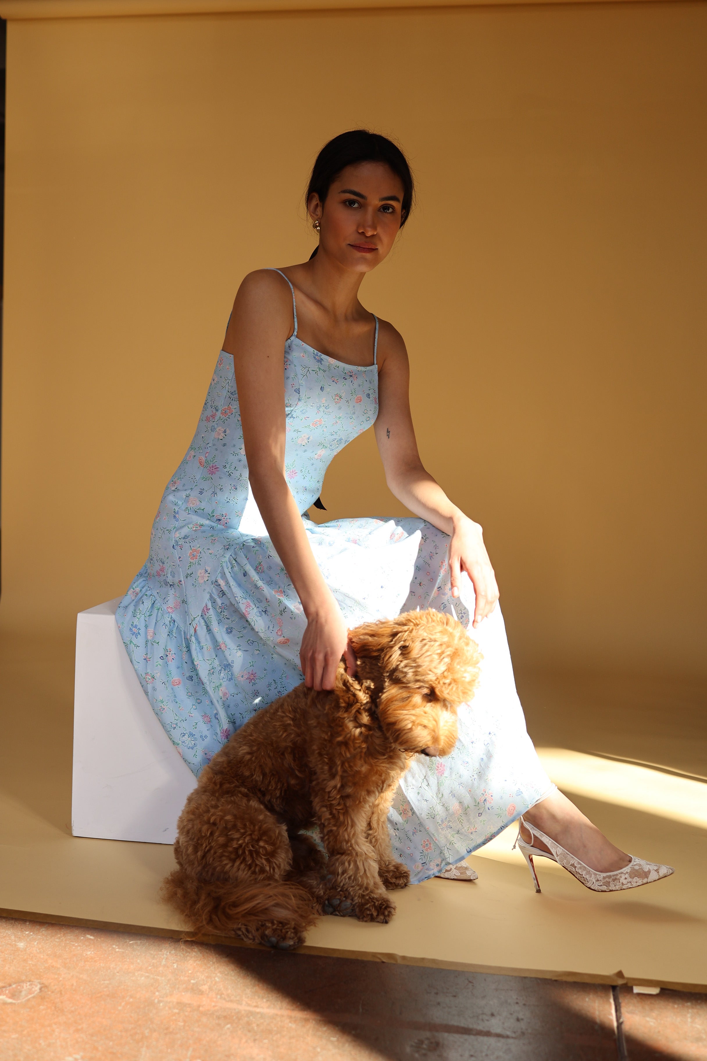 Light blue, floral dress with spaghetti straps and a tiered skirt, ideal for any occasion, purchase at SISTER NY